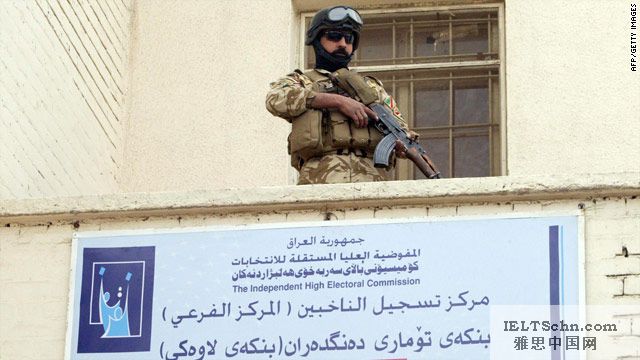 An Iraqi soldier stands guard at a polling station in Basra ahead of the March 7 general elections.